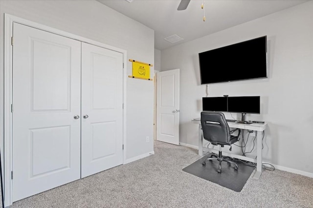 carpeted office featuring ceiling fan