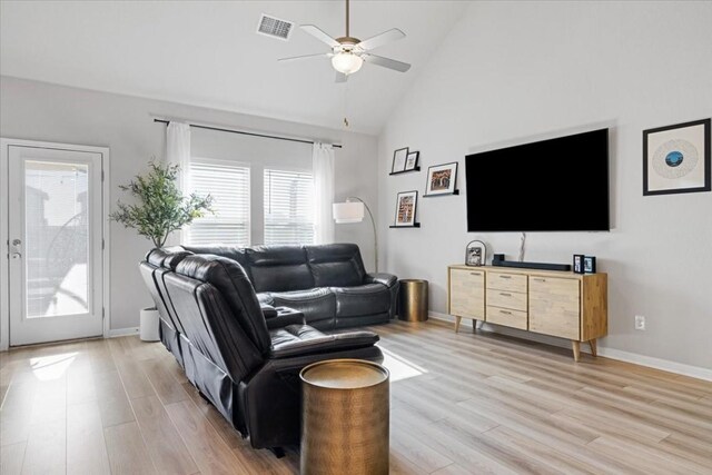 living room with high vaulted ceiling, light hardwood / wood-style flooring, and ceiling fan