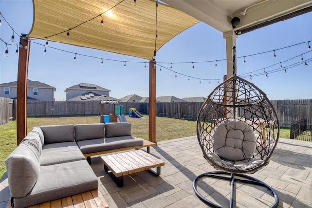 view of patio with an outdoor living space and a playground