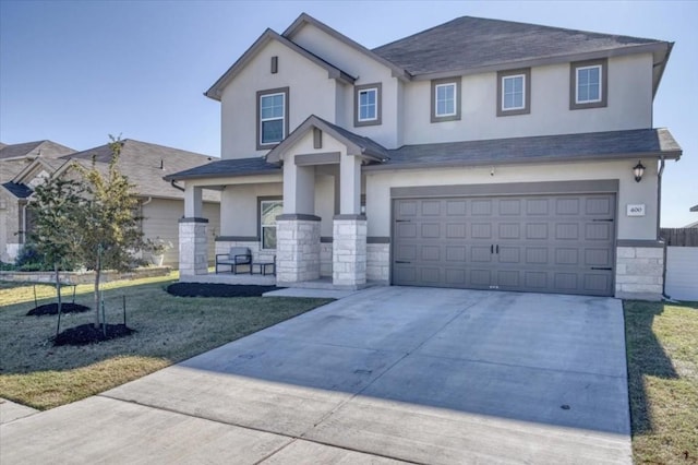 view of front of property with an attached garage, covered porch, stone siding, concrete driveway, and stucco siding