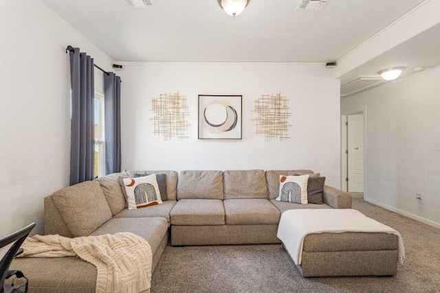 living area featuring carpet, visible vents, and baseboards