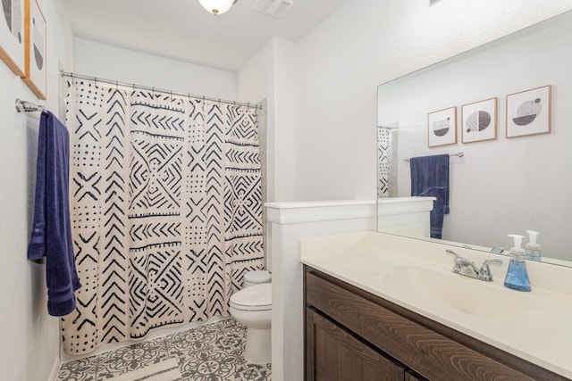 bathroom with curtained shower, tile patterned flooring, toilet, visible vents, and vanity