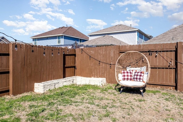 view of yard featuring a gate and fence