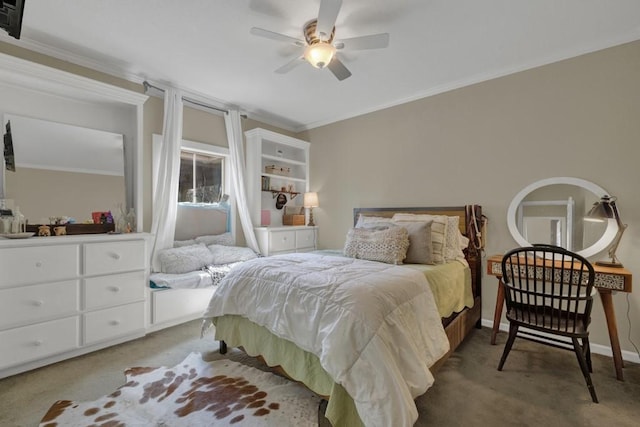 carpeted bedroom with ceiling fan and crown molding