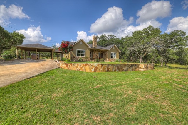 ranch-style house featuring a carport and a front yard