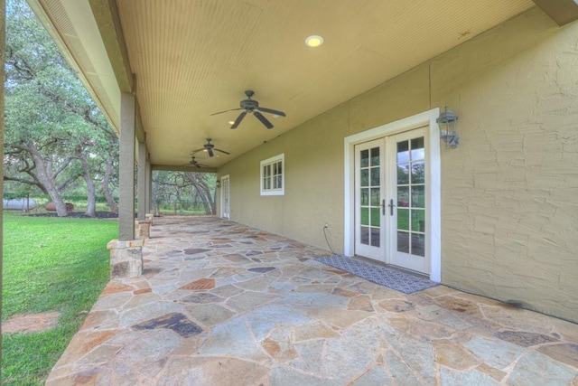 view of patio featuring ceiling fan and french doors