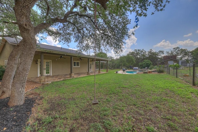 view of yard featuring ceiling fan and a patio area