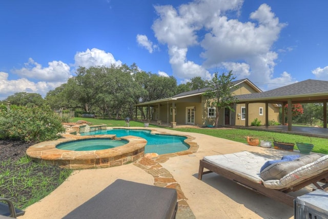 view of pool featuring an in ground hot tub and a patio area