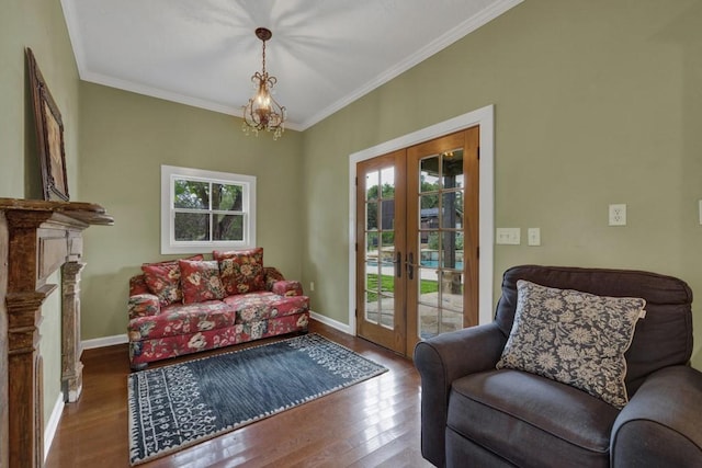 sitting room with a wealth of natural light, french doors, crown molding, and hardwood / wood-style flooring