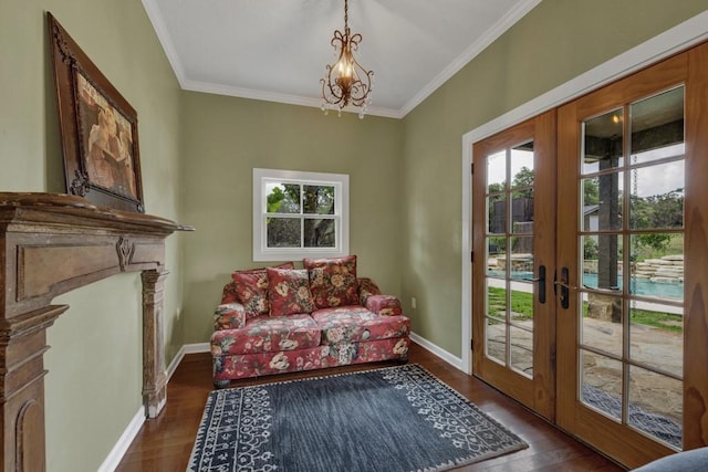 interior space featuring a chandelier, crown molding, dark wood-type flooring, and french doors