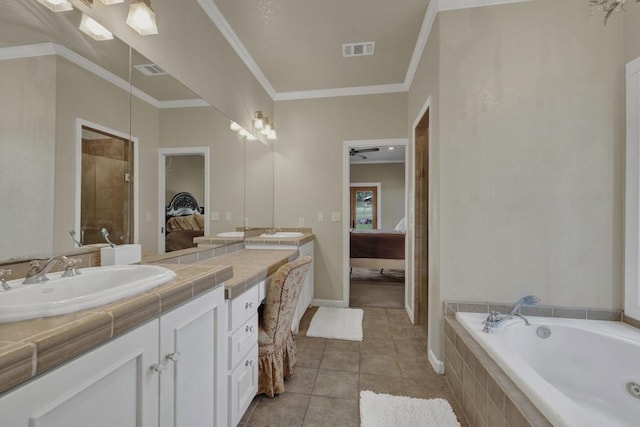 bathroom with ceiling fan, a relaxing tiled tub, tile patterned floors, crown molding, and vanity