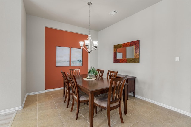 dining space with an inviting chandelier