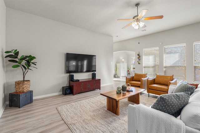 living room featuring ceiling fan and light hardwood / wood-style flooring