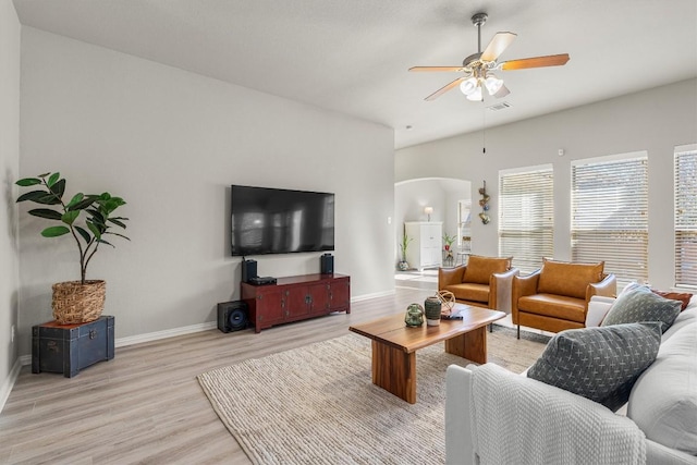 living room with ceiling fan and light wood-type flooring