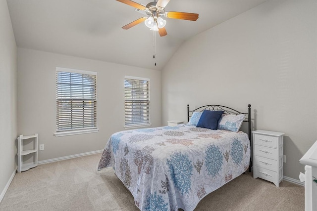 carpeted bedroom featuring ceiling fan and vaulted ceiling