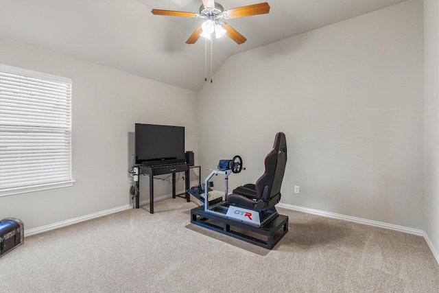 exercise area with ceiling fan, carpet floors, and vaulted ceiling