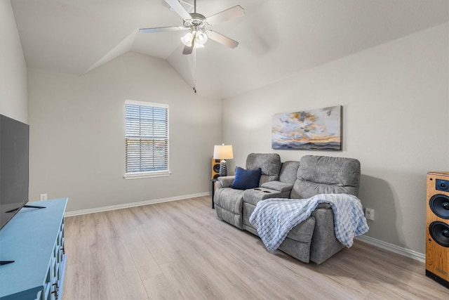 living room featuring light hardwood / wood-style flooring, ceiling fan, and lofted ceiling