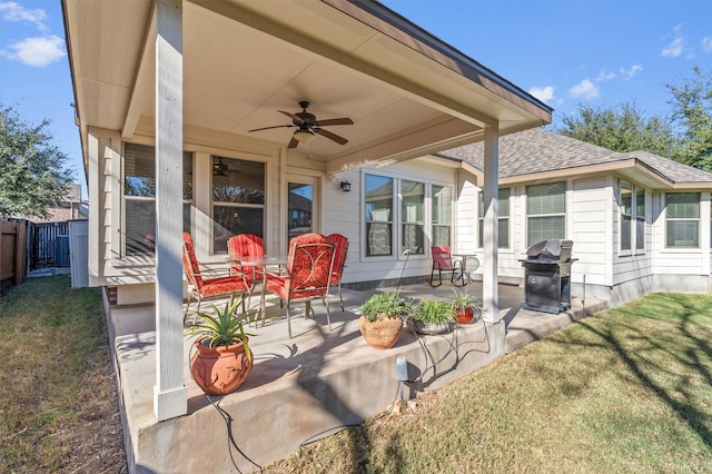 view of patio with ceiling fan and a grill