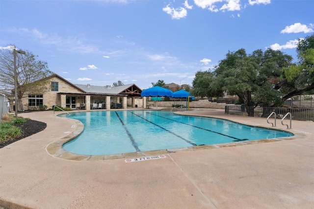 view of pool featuring a patio area