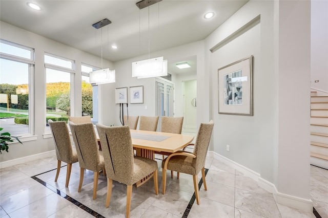 dining room with light tile patterned flooring