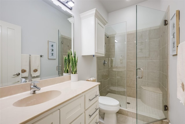 bathroom featuring walk in shower, vanity, and toilet