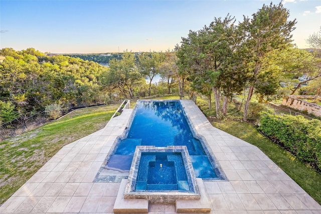 view of swimming pool featuring an in ground hot tub