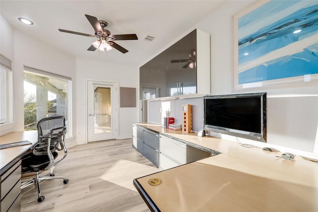 office space featuring ceiling fan and light hardwood / wood-style floors