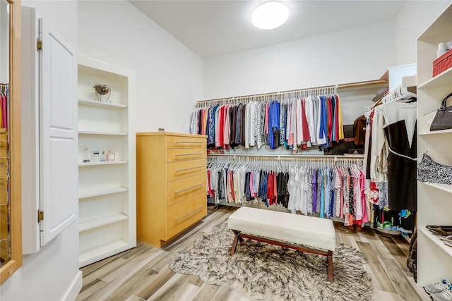 walk in closet featuring light hardwood / wood-style floors