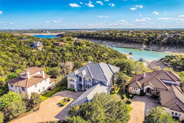 birds eye view of property with a water view