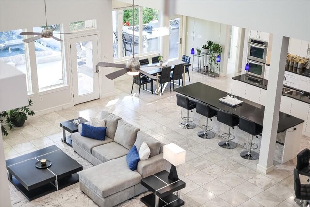 7302 Matisse Pointe Dr, Jonestown, TX 78645 - living room with plenty of natural light, ceiling fan, and baseboards