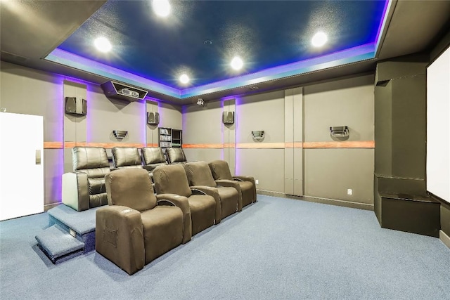 7302 Matisse Pointe Dr, Jonestown, TX 78645 - cinema room with a tray ceiling, carpet flooring, and recessed lighting