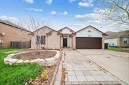 ranch-style home featuring a garage