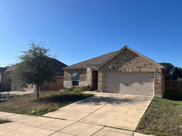 ranch-style home with a front yard and a garage