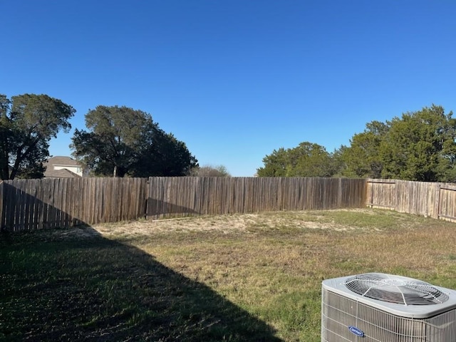 view of yard with central AC