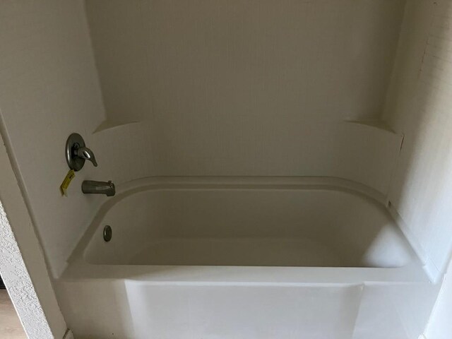 bathroom featuring a tub to relax in
