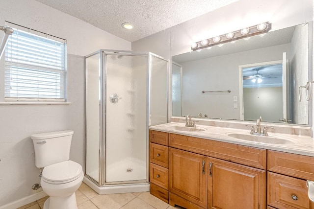 bathroom featuring tile patterned floors, an enclosed shower, vanity, a textured ceiling, and toilet