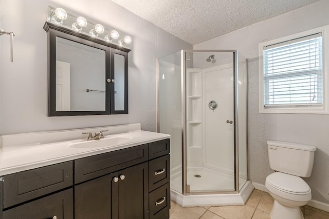 bathroom with tile patterned flooring, a textured ceiling, toilet, a shower with door, and vanity