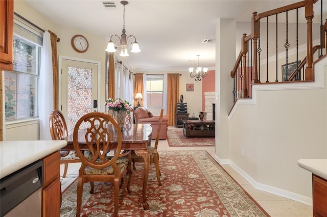 tiled dining area with a notable chandelier