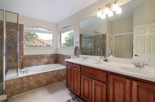 bathroom featuring tile patterned floors, plus walk in shower, and vanity