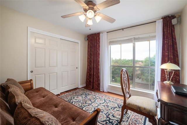 office area with ceiling fan and hardwood / wood-style floors