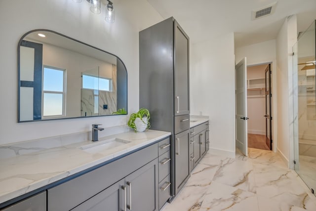 bathroom featuring vanity and a shower