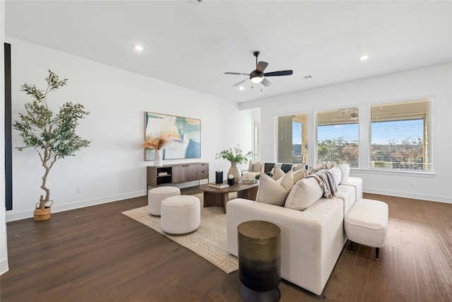 living room with dark hardwood / wood-style floors and ceiling fan