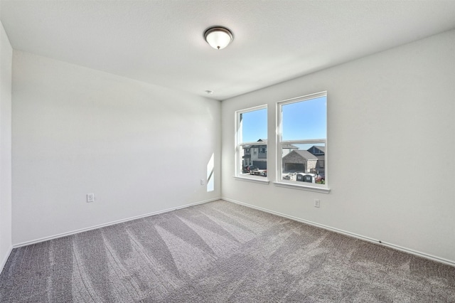 unfurnished room with carpet