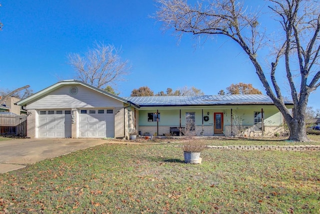 single story home with covered porch, a garage, and a front lawn