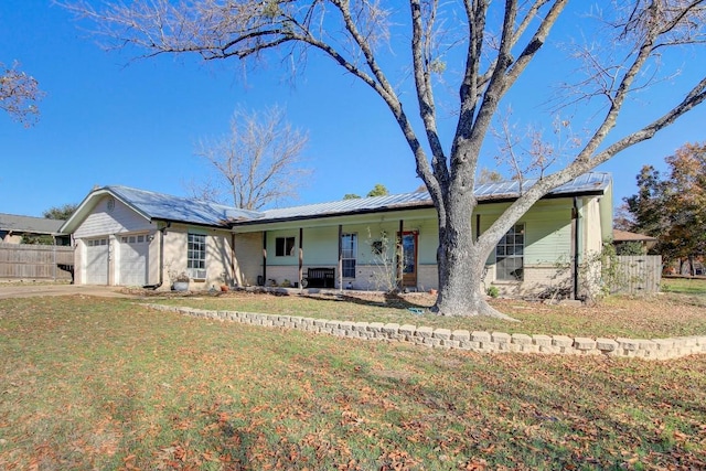 ranch-style house featuring a porch, a garage, and a front lawn