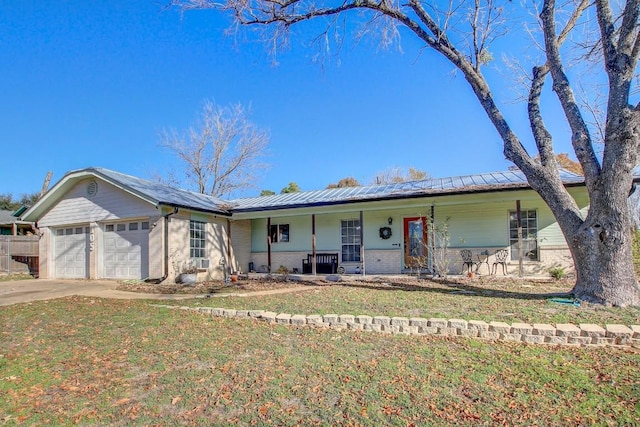 ranch-style home with a porch, a front yard, and a garage