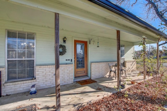 entrance to property with covered porch