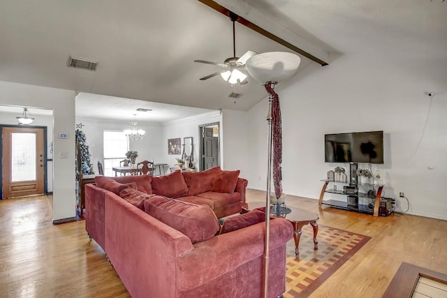 living room featuring vaulted ceiling with beams, light hardwood / wood-style floors, ceiling fan with notable chandelier, and ornamental molding