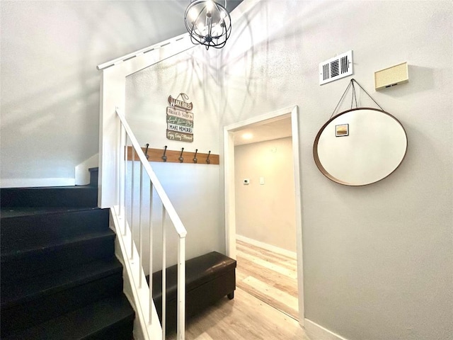 stairway featuring hardwood / wood-style flooring