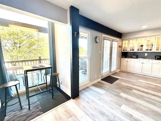 doorway to outside featuring light hardwood / wood-style flooring